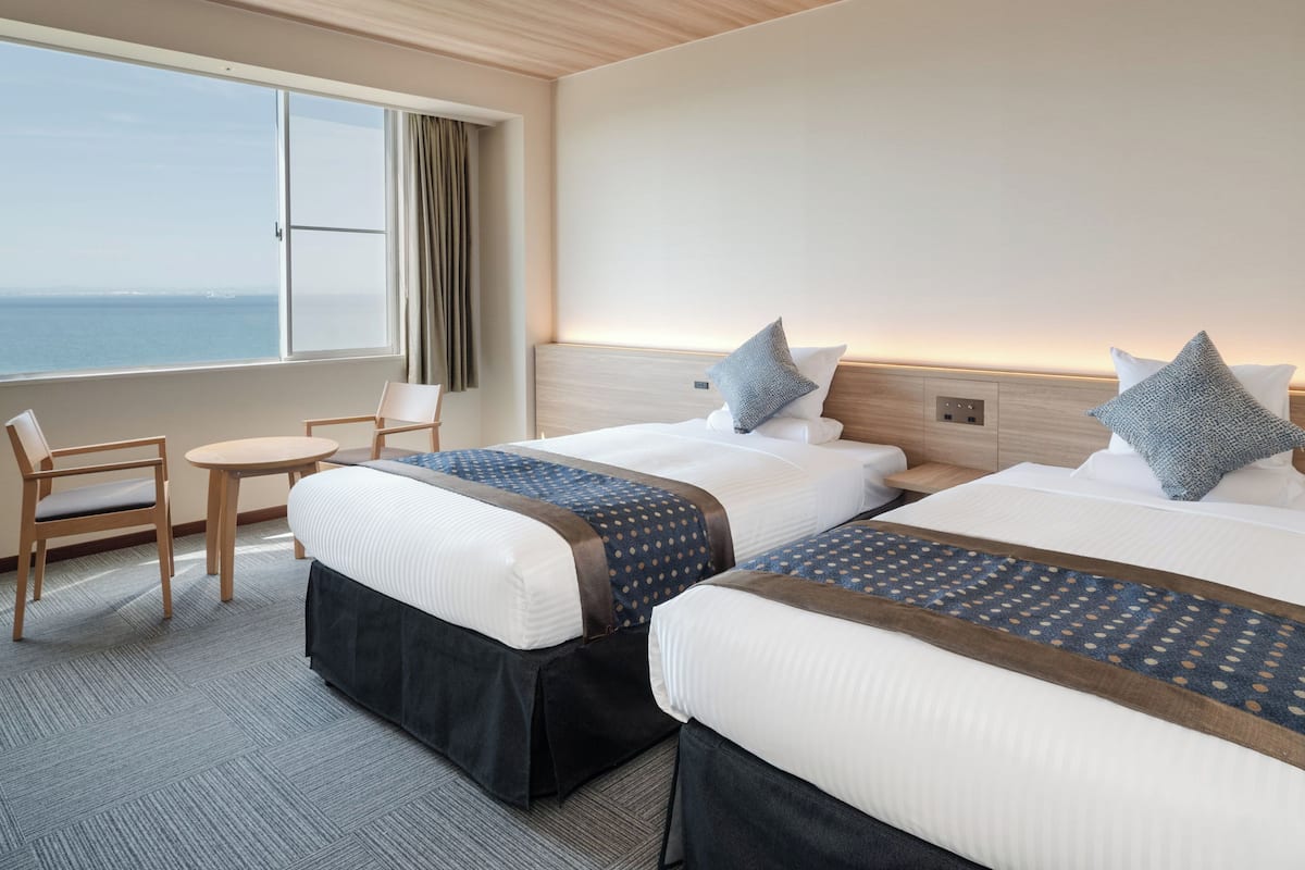 Standard Twin Room, Non Smoking, Ocean View (with Toilet) | 1 bedroom, in-room safe, bed sheets