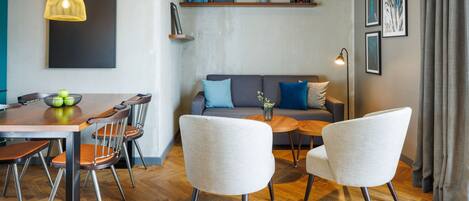 Penthouse Green Vibes | Living area | 43-inch flat-screen TV with cable channels, TV, heated floors