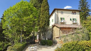 A two-story building with a stone facade, a tiled roof, and a small balcony. - Ridaldi by Interhome (Greve in Chianti)