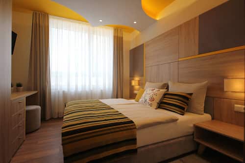 Executive Apartment, 2 Bedrooms | Desk, soundproofing, iron/ironing board, free cots/infant beds