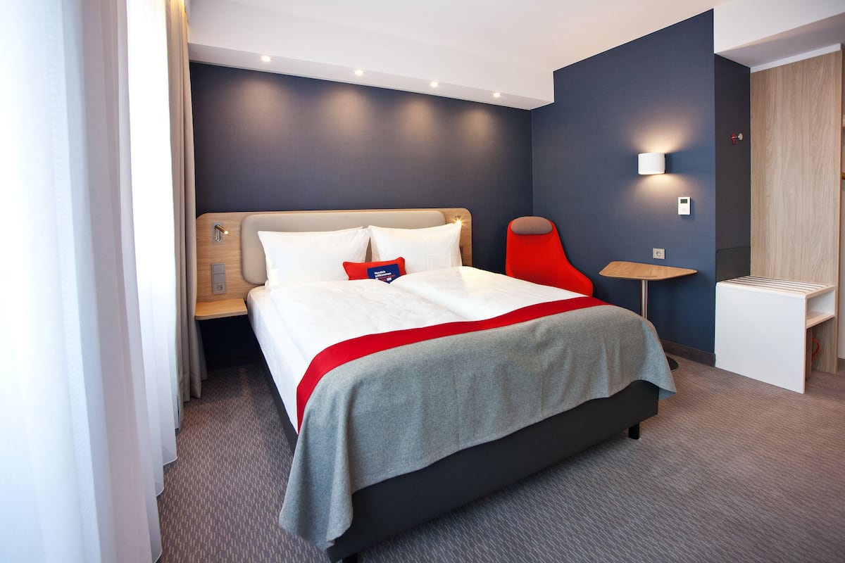 Hypo-allergenic bedding, laptop workspace, blackout drapes
