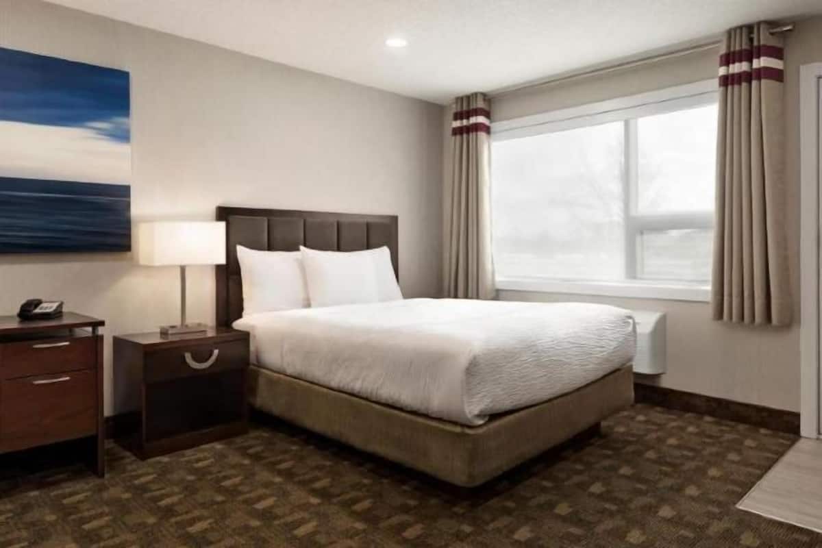 Individually furnished, desk, laptop workspace, iron/ironing board