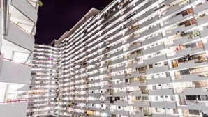 A multi-story residential building with balconies, air conditioning units, and visible windows. - Eastern Court 22 by Sanguine (George Town)