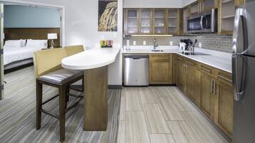 Premium bedding, desk, laptop workspace, blackout drapes