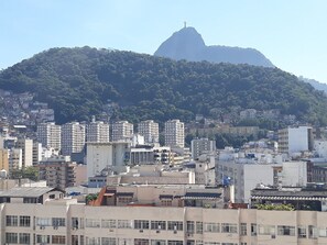Stunning city views with a lush hillside backdrop.