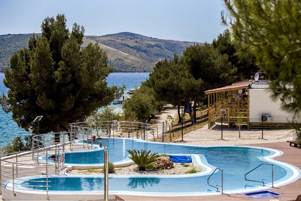 Seasonal outdoor pool, pool umbrellas, pool loungers