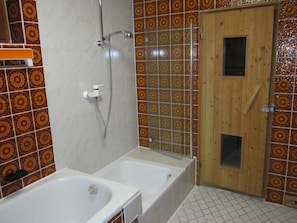 Combined shower/tub, hair dryer, towels, soap