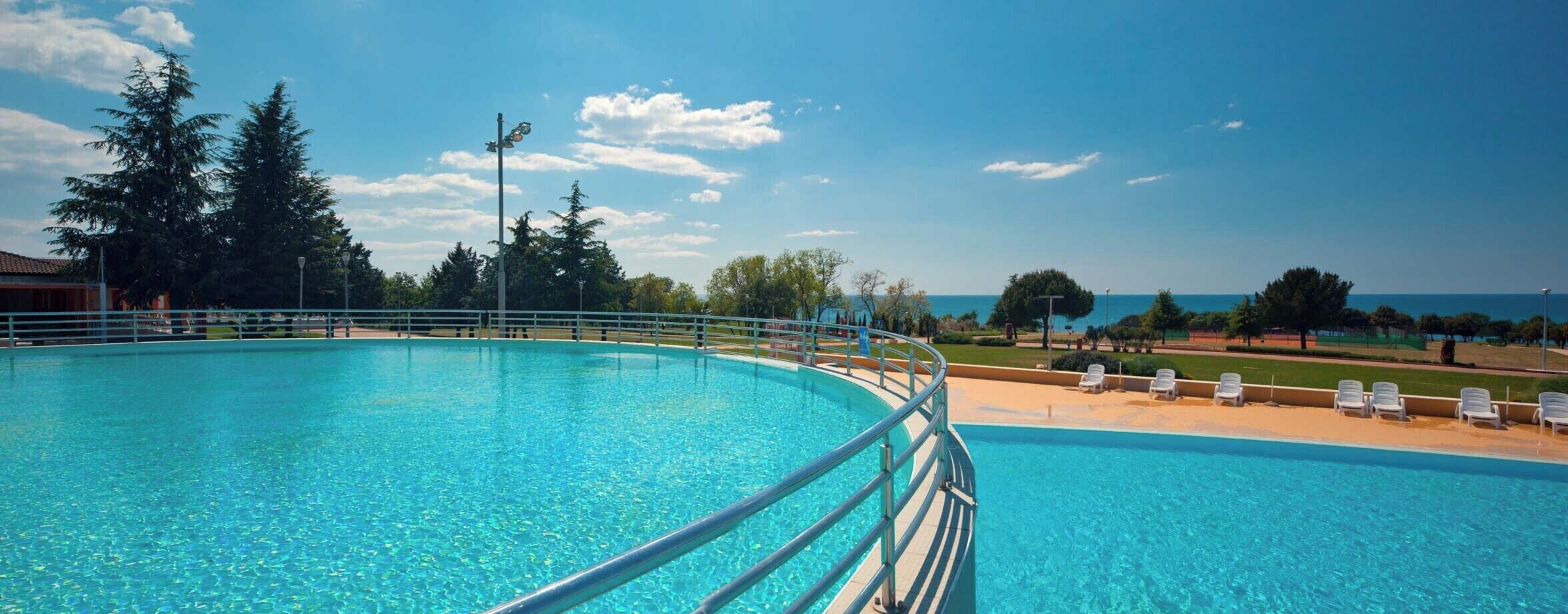 Seasonal outdoor pool, pool umbrellas, pool loungers