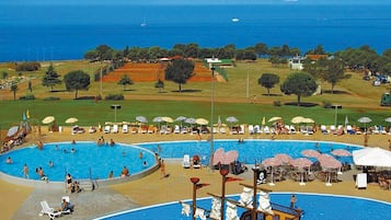 Seasonal outdoor pool, pool umbrellas, pool loungers