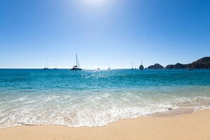 On the beach, sun loungers, beach towels