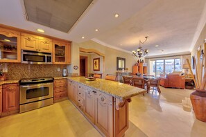 Enjoy meals in the well-appointed kitchen with modern appliances and adjacent dining area.