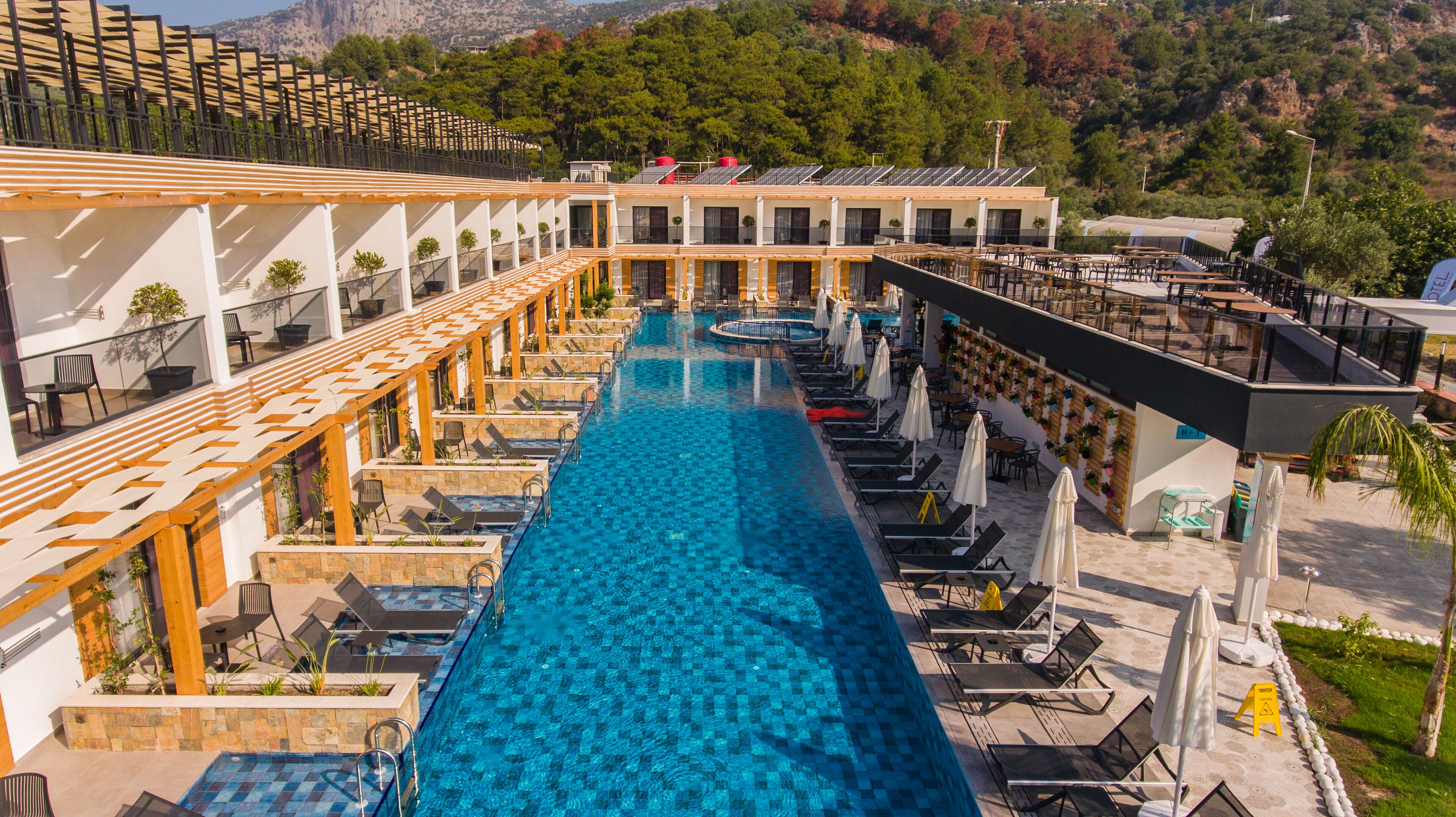 seasonal outdoor pool, open 8:00 am to 6:00 pm, pool umbrellas