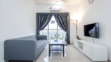 Deluxe Apartment, 3 Bedrooms | Living area | 40-inch flat-screen TV with cable channels, LED TV