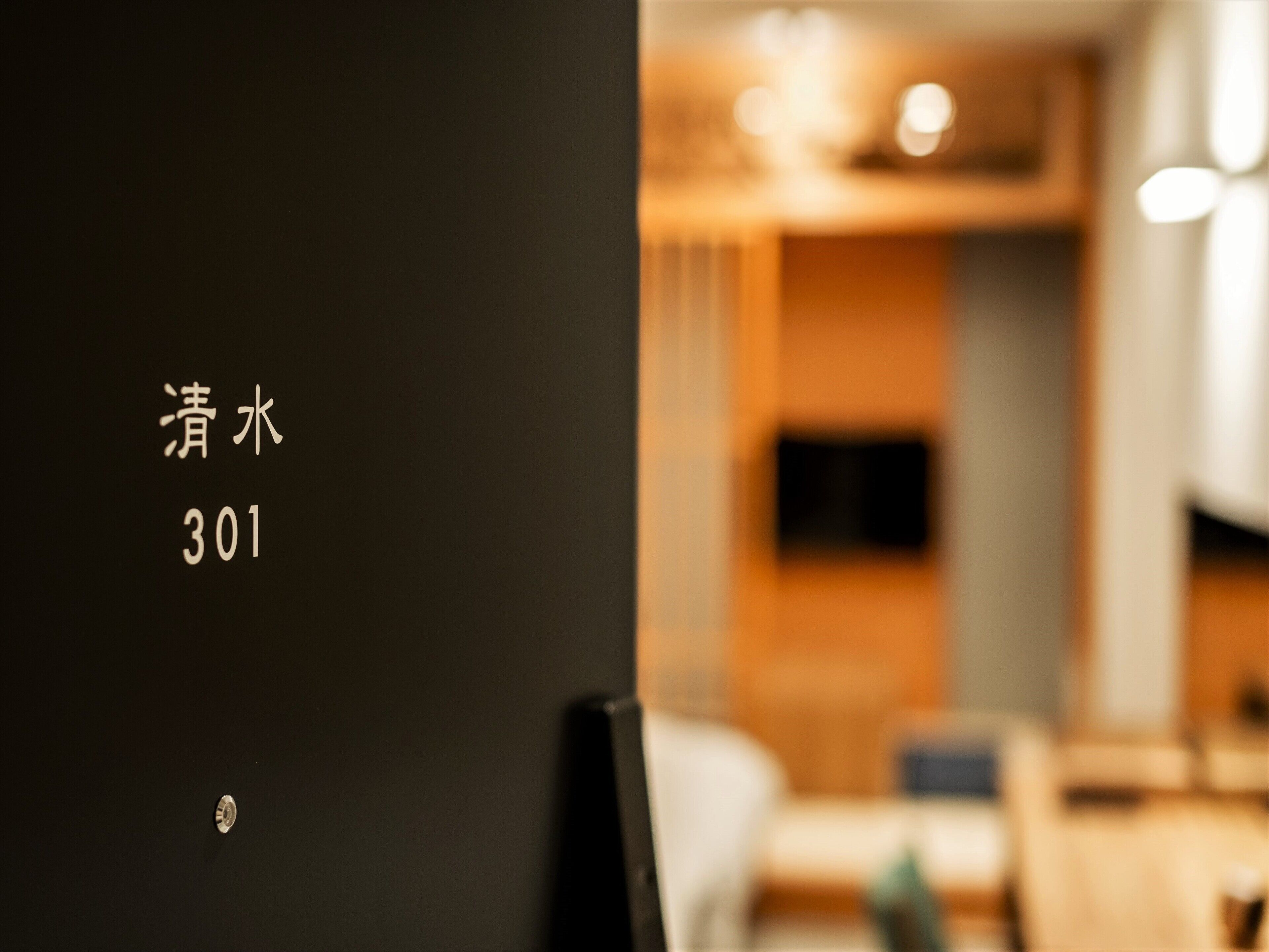 A hotel room interior with a blurred background.