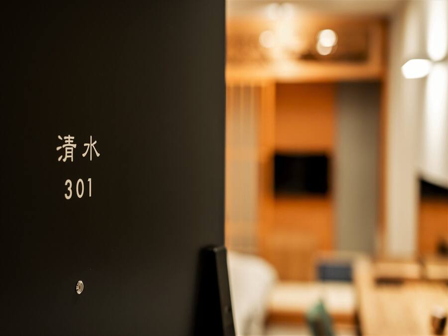 A hotel room interior with a blurred background.