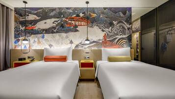 A hotel room with two beds, a large mural on the wall, and a modern design.