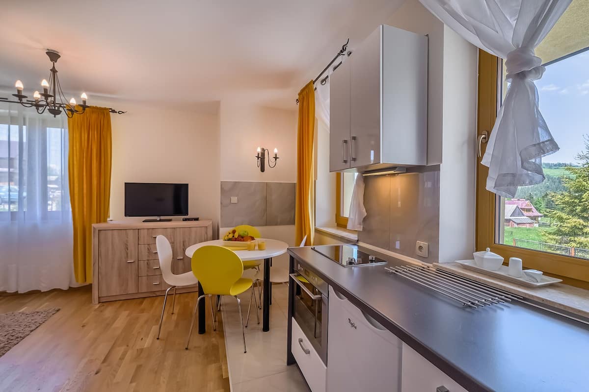 Classic Apartment | Living area | 38-inch TV with cable channels