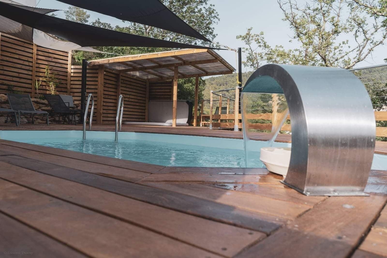 Seasonal outdoor pool, open 10:00 AM to 10:00 PM, pool umbrellas