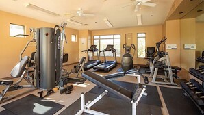 A gym with treadmills, weight machines, and a bench press. - Reduced Rates Just Posted! Cachet Condo (Scottsdale)