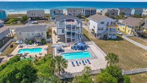 A residential area with two swimming pools, a beach, and ocean views. - "A Penny From Heaven" 2nd row luxury 4 bedroom with pool (Holden Beach)
