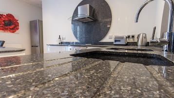 1 bed - Captain's Quarters | Private kitchen | Fridge, microwave, oven, highchair