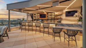 A rooftop bar with a panoramic city view, modern bar setup, and comfortable seating. - JW Marriott Anaheim Resort (Anaheim)