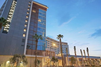 A rooftop bar with a panoramic city view, modern bar setup, and comfortable seating. at JW Marriott Anaheim Resort