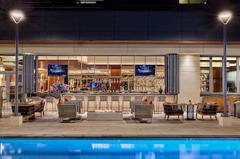 Outdoor pool, cabanas (surcharge), pool umbrellas at JW Marriott Anaheim Resort