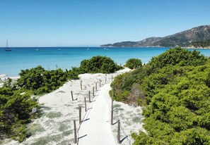On the beach, sun-loungers