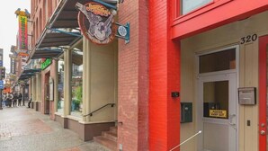 A street with a red building, a sign for 'Jimmy Buffet's Margaritaville', and a door labeled 'POSTED KEEP OUT'.
