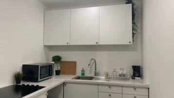 Fridge, microwave, stovetop, coffee/tea maker