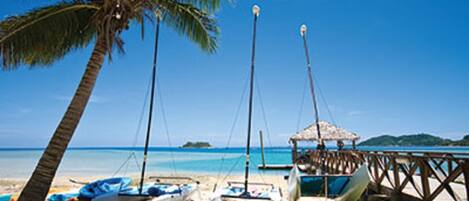 On the beach, sun-loungers, beach towels