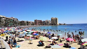 On the beach, sun loungers, beach towels