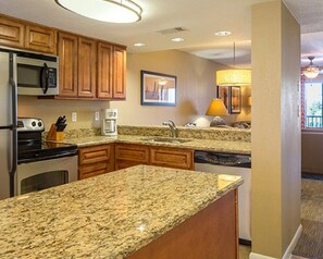 Microwave, dishwasher, coffee/tea maker, cookware/dishes/utensils