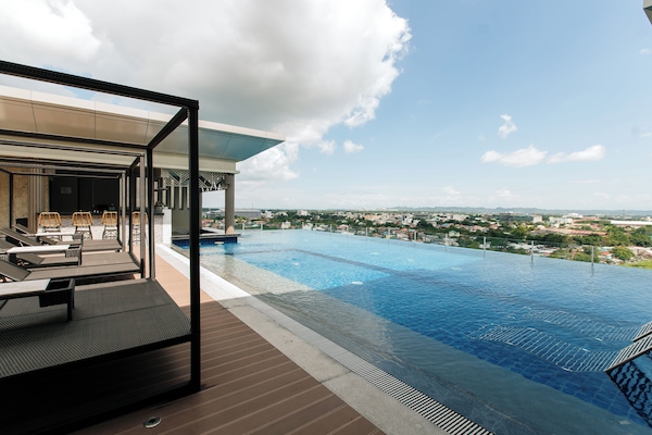 Outdoor pool, open 6:00 AM to 10:00 PM, sun loungers