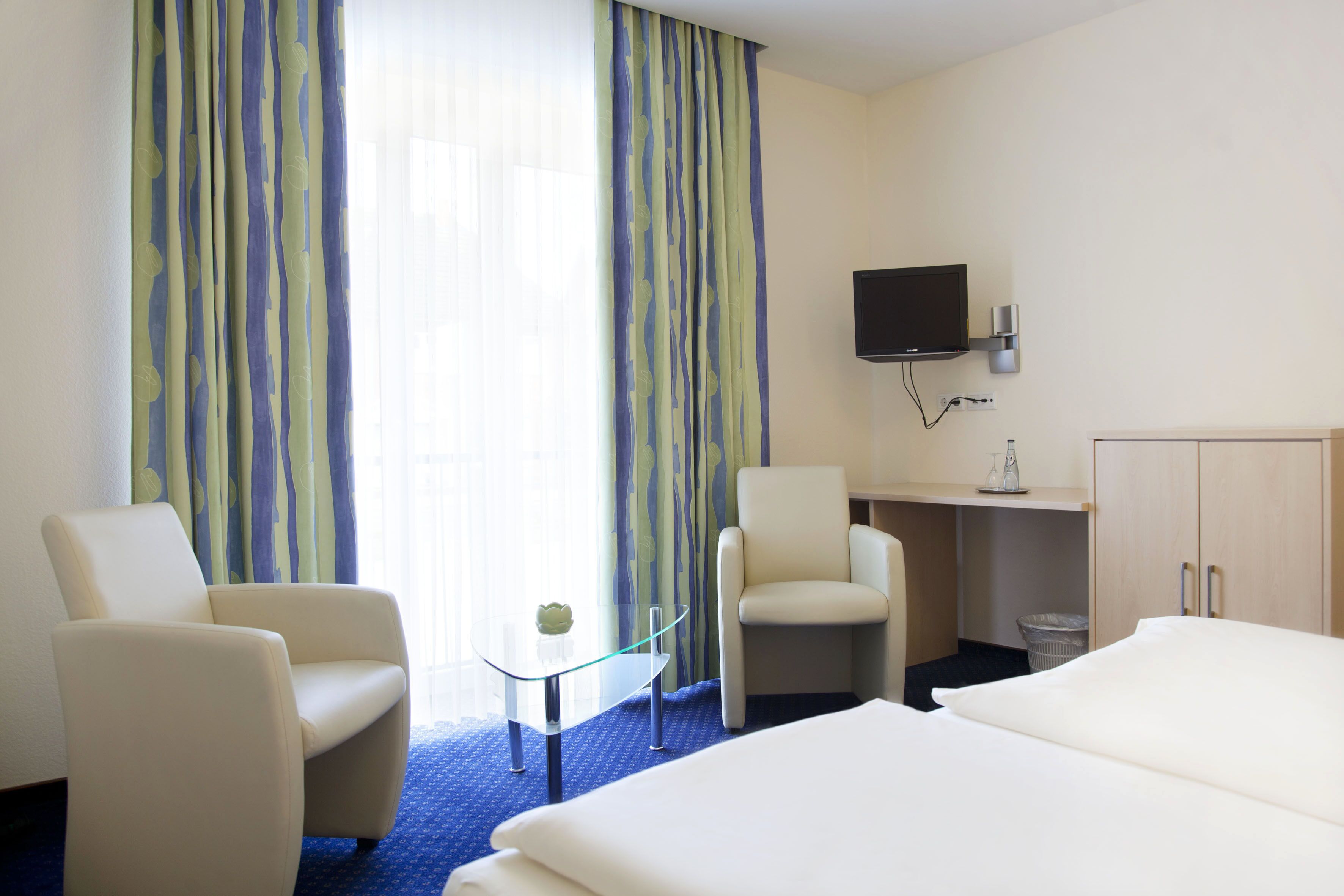 hypo-allergenic bedding, desk, blackout curtains, soundproofing