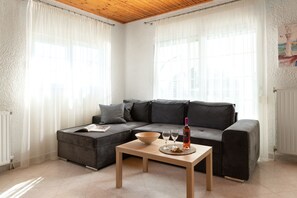 Family Villa, 4 Bedrooms, Sea View, Sea Facing | Living area | 40-inch flat-screen TV with satellite channels, TV, fireplace - House of Paradise in front of the golf court-sea (Rhodes)