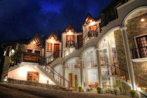 A multi-story hotel with a grand entrance, multiple balconies, and a stone facade. - The Ramp Hotel (Nuwara Eliya)