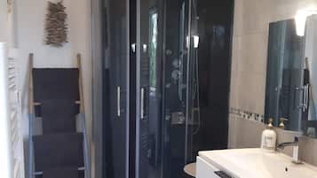 Shower, hair dryer, towels, toilet paper