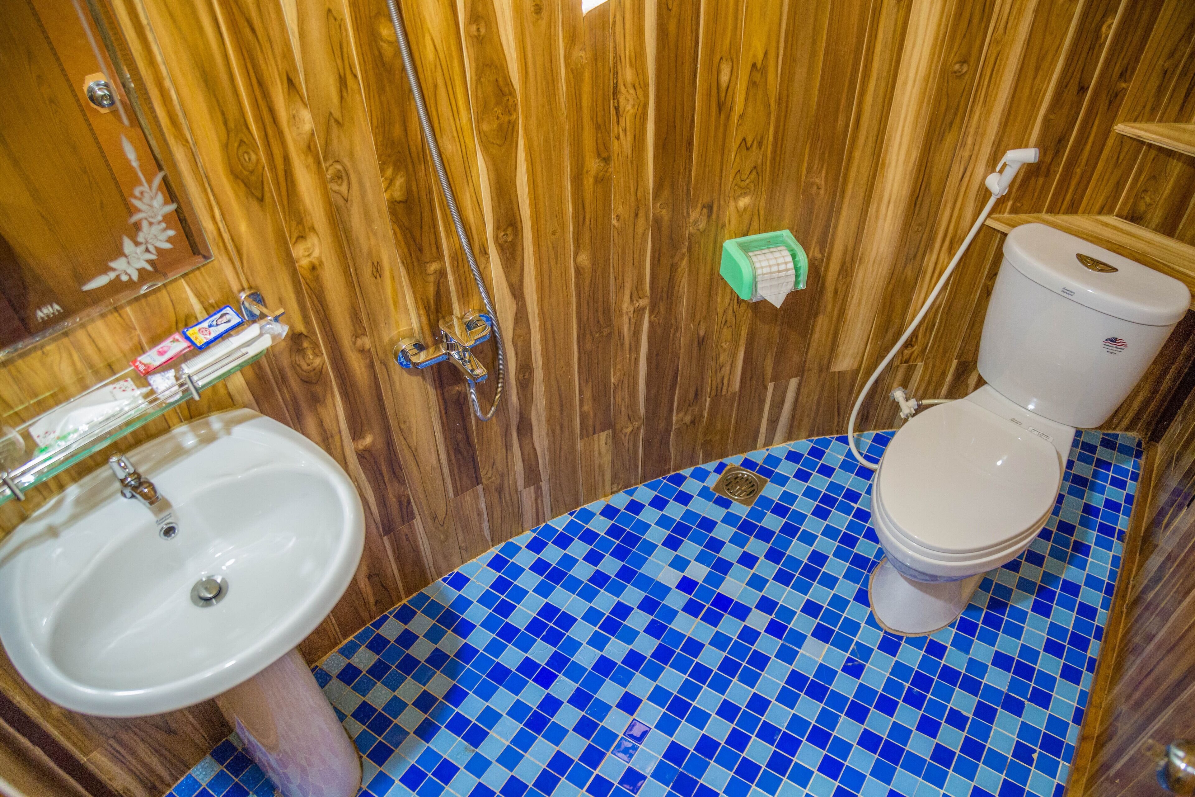 shower, designer toiletries, slippers, towels