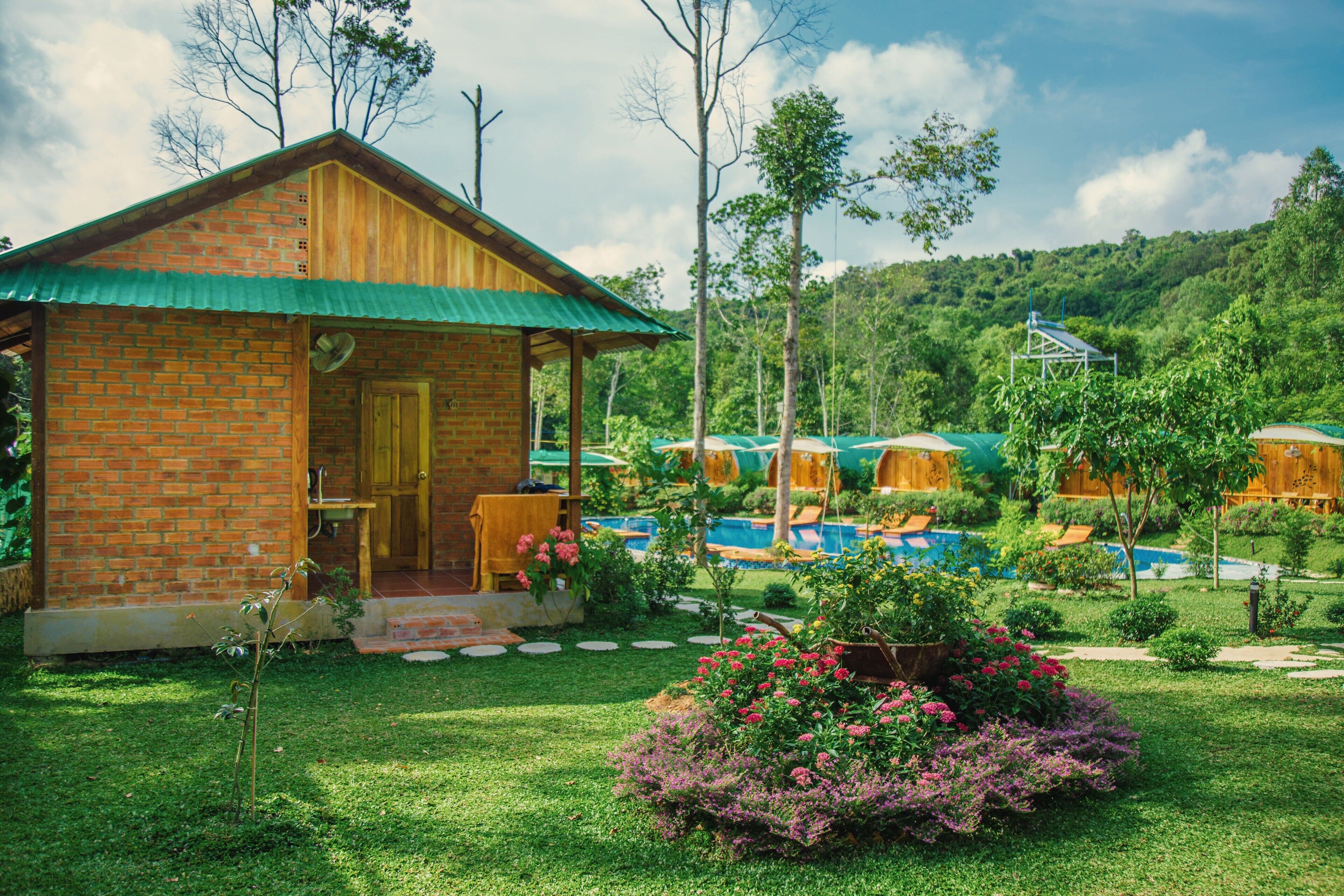comfort room, multiple beds, pool view | garden view