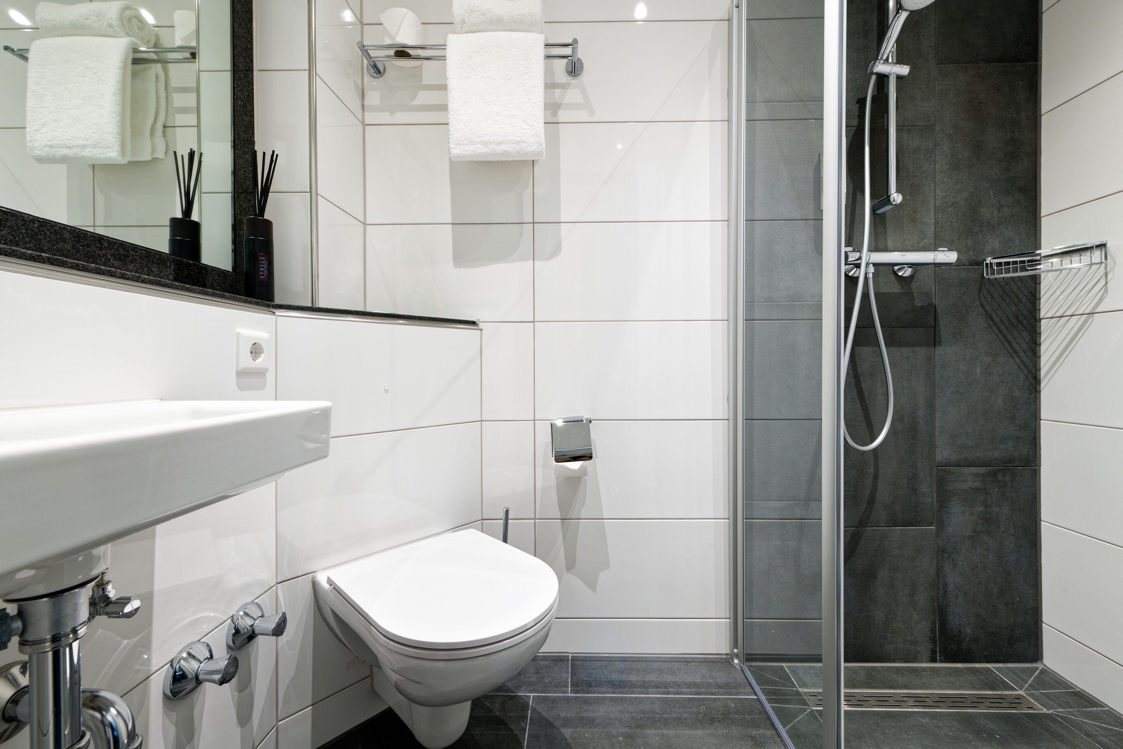 shower, hair dryer, bathrobes, slippers