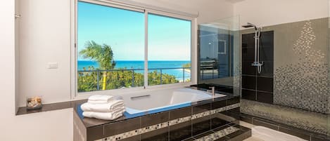 Bathtub, hair dryer, towels, soap