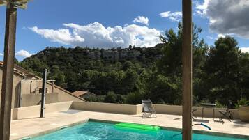 Seasonal outdoor pool, open 10:00 AM to 7:30 PM, pool loungers