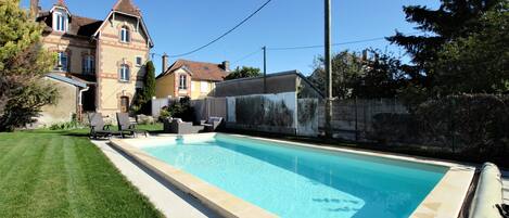 Seasonal outdoor pool, open 10:00 AM to 7:00 PM, sun loungers