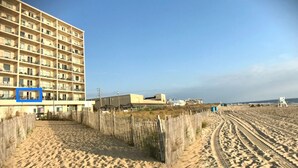 A beachfront hotel with multiple floors, a sandy beach in the foreground, and a clear sky. - Flood Damaged - Renovated 2026 ~ Excuse Glitches - Still Quaint VINTAGE Studio (Rehoboth Beach)