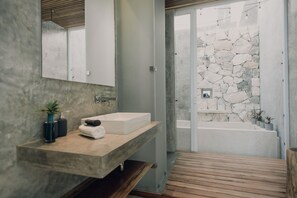 Bathtub, hair dryer, towels, soap