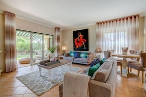 Smart TV, fireplace, books, printers