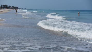 On the beach, sun-loungers, beach towels