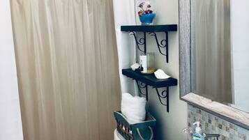 Shower, towels, soap, toilet paper